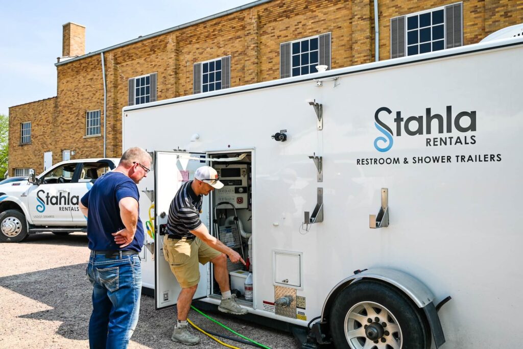 Stahla technician servicing a restroom trailer